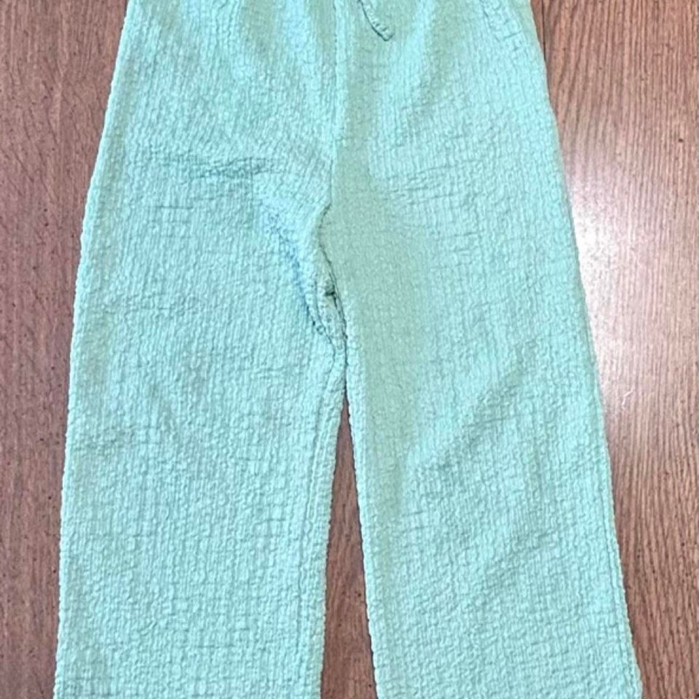 Mint green crinkle wide leg pants by Cotton On Kids in a size 5.